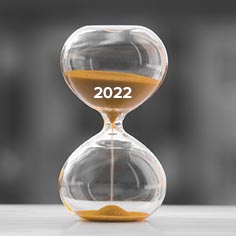 Hourglass marked 2022 with sand running out - Year End Considerations